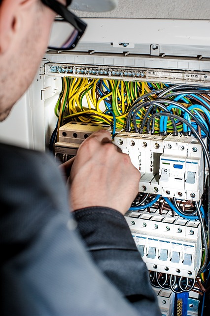 electrician at circuit board