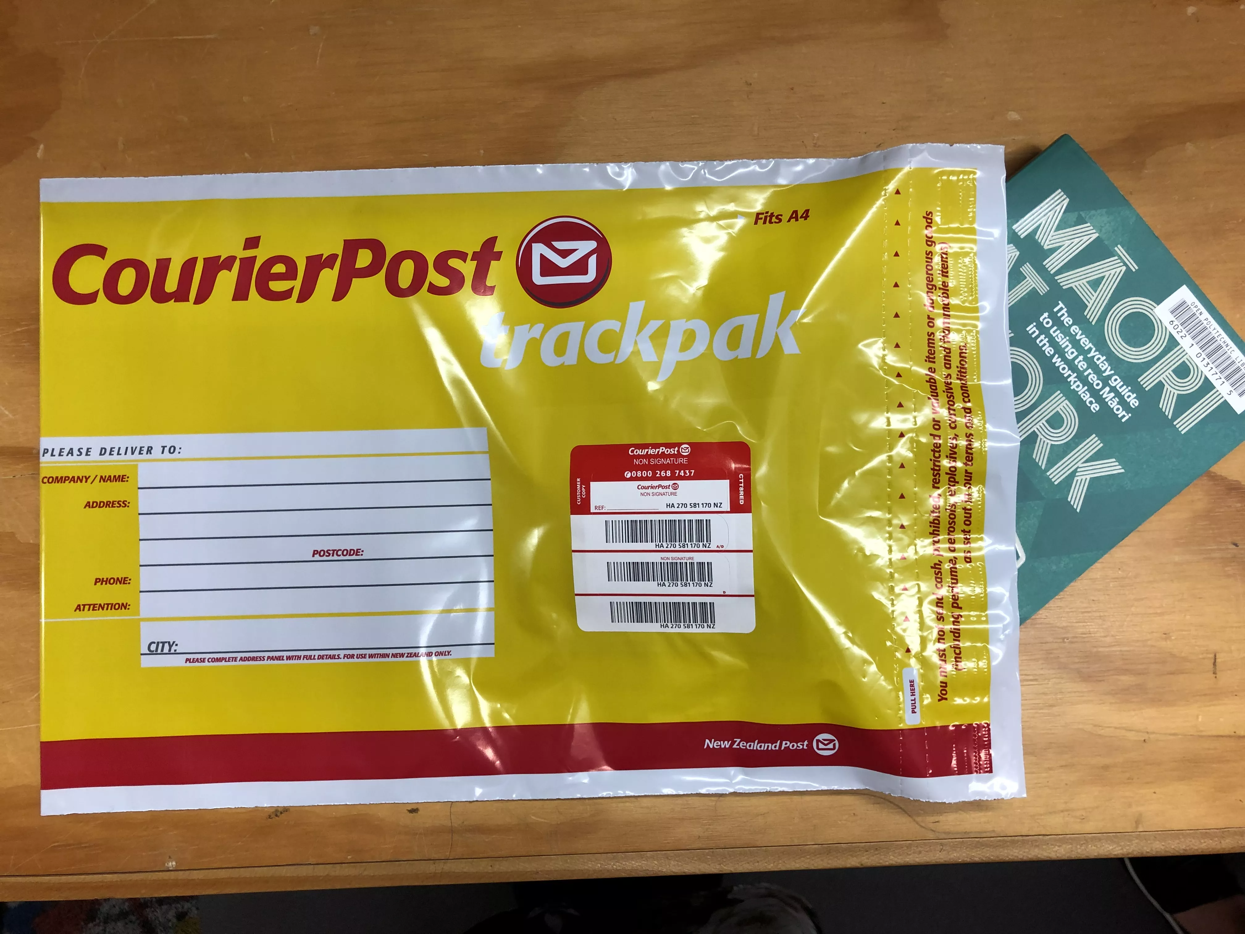 Putting a book into return courier bag