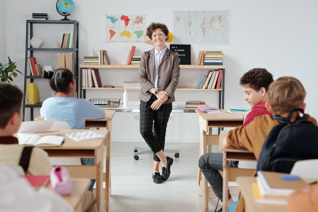teacher at the front of a classroom