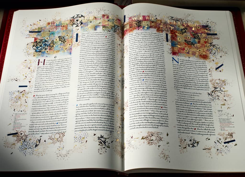 The Saint John's Bible, "Loaves and Fish" open page gold illumination and text from Volume 6.